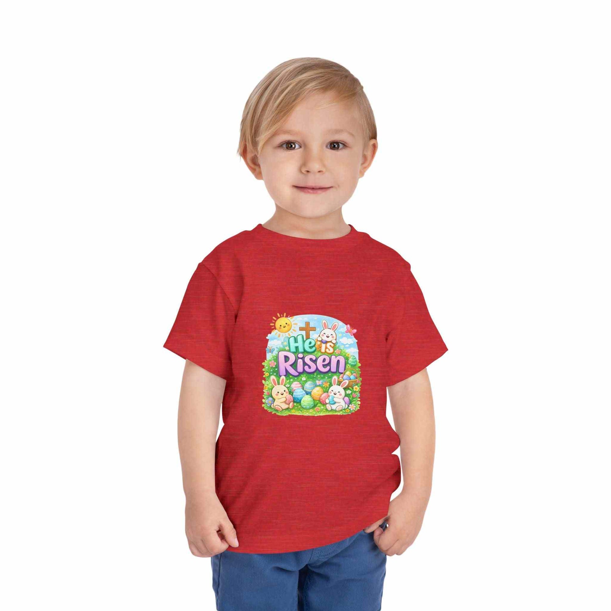 He Is Risen toddler tee with Easter bunny and cross design in pastel colors