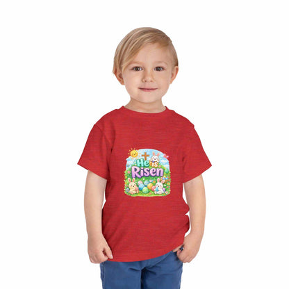 He Is Risen toddler tee with Easter bunny and cross design in pastel colors