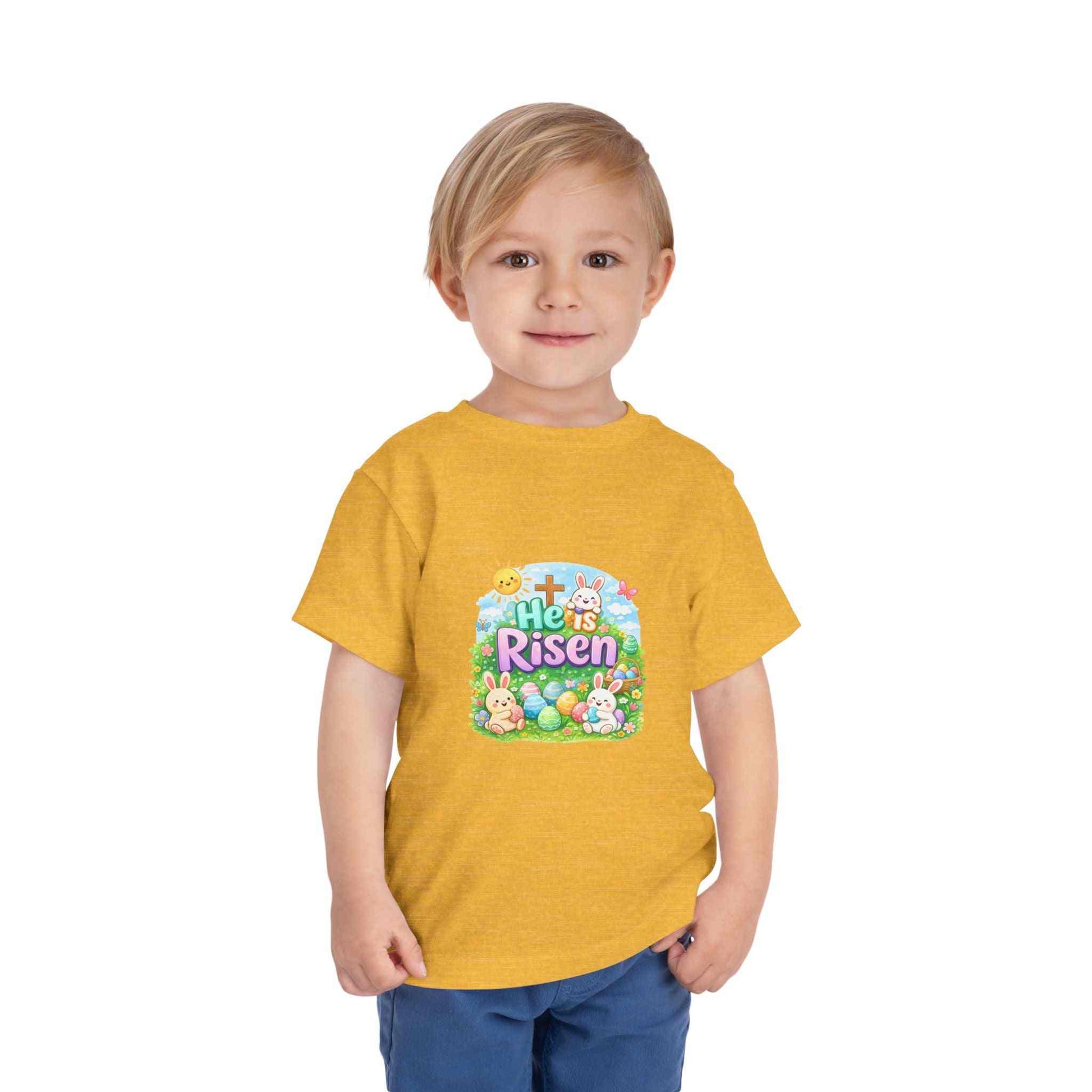 Toddler t-shirt with He Is Risen Easter bunny and cross design in pastel colors