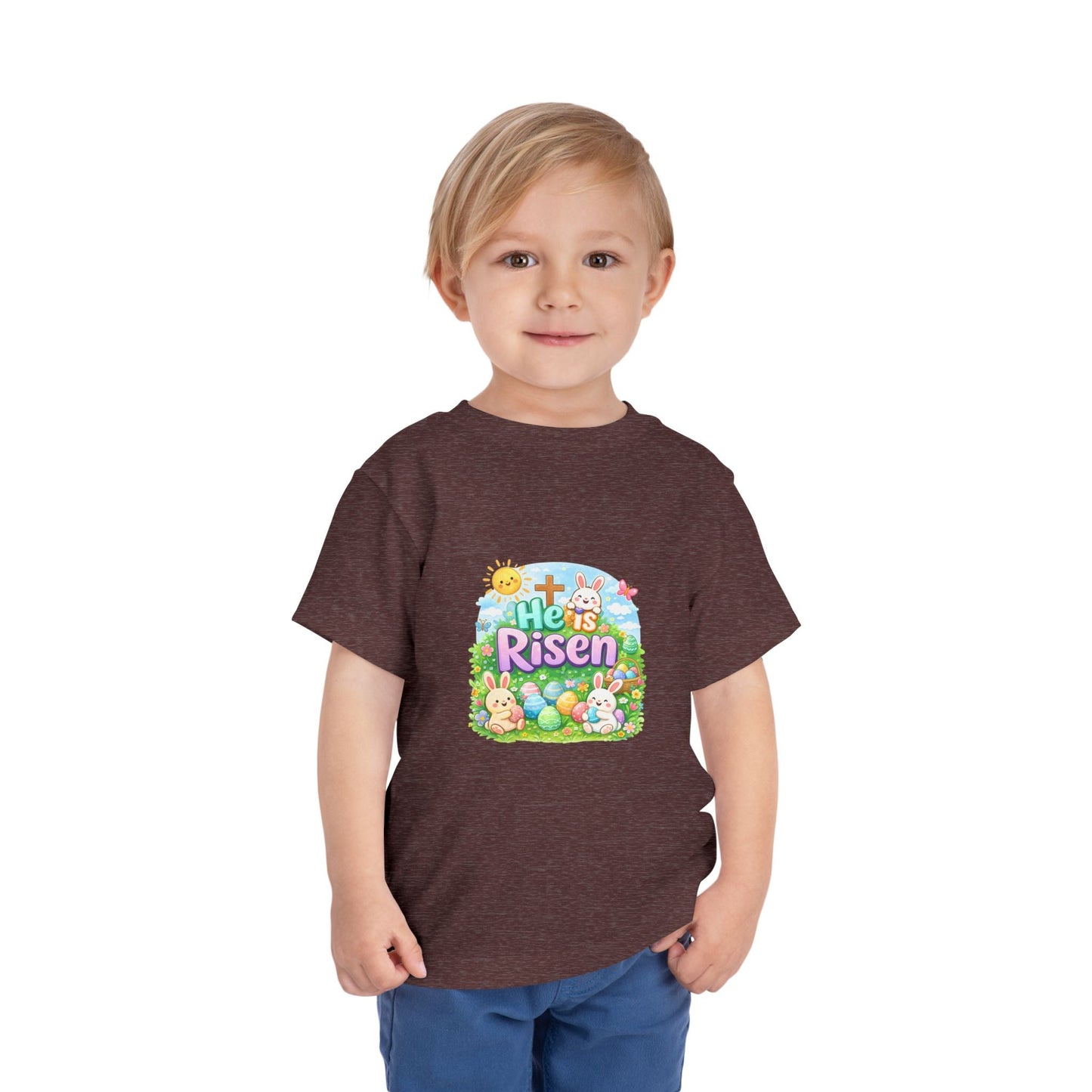 He Is Risen toddler tee with Easter bunny, cross, and pastel eggs design on soft lightweight fabric