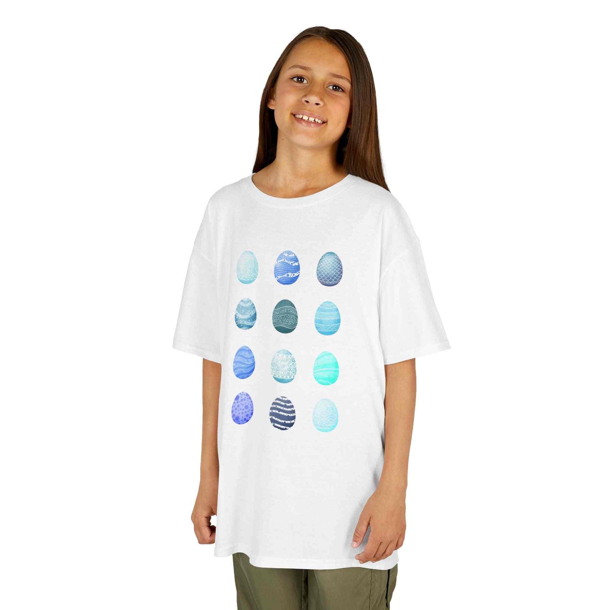 Kids tee with blue watercolor egg pattern on white cotton fabric