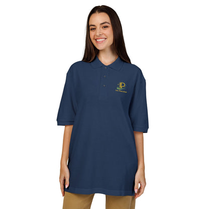 Embroidered crest polo shirt with relaxed fit, lightweight pique fabric, flat knit collar, metal buttons, and subtle chest logo detail