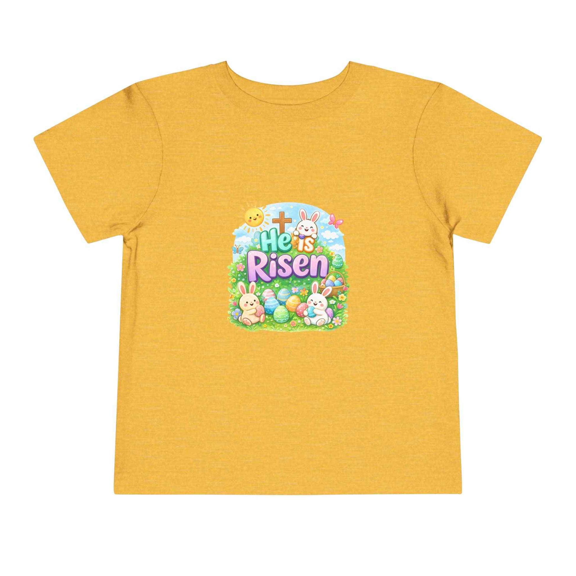 He Is Risen toddler tee with Easter bunny, cross, and pastel eggs design for kids