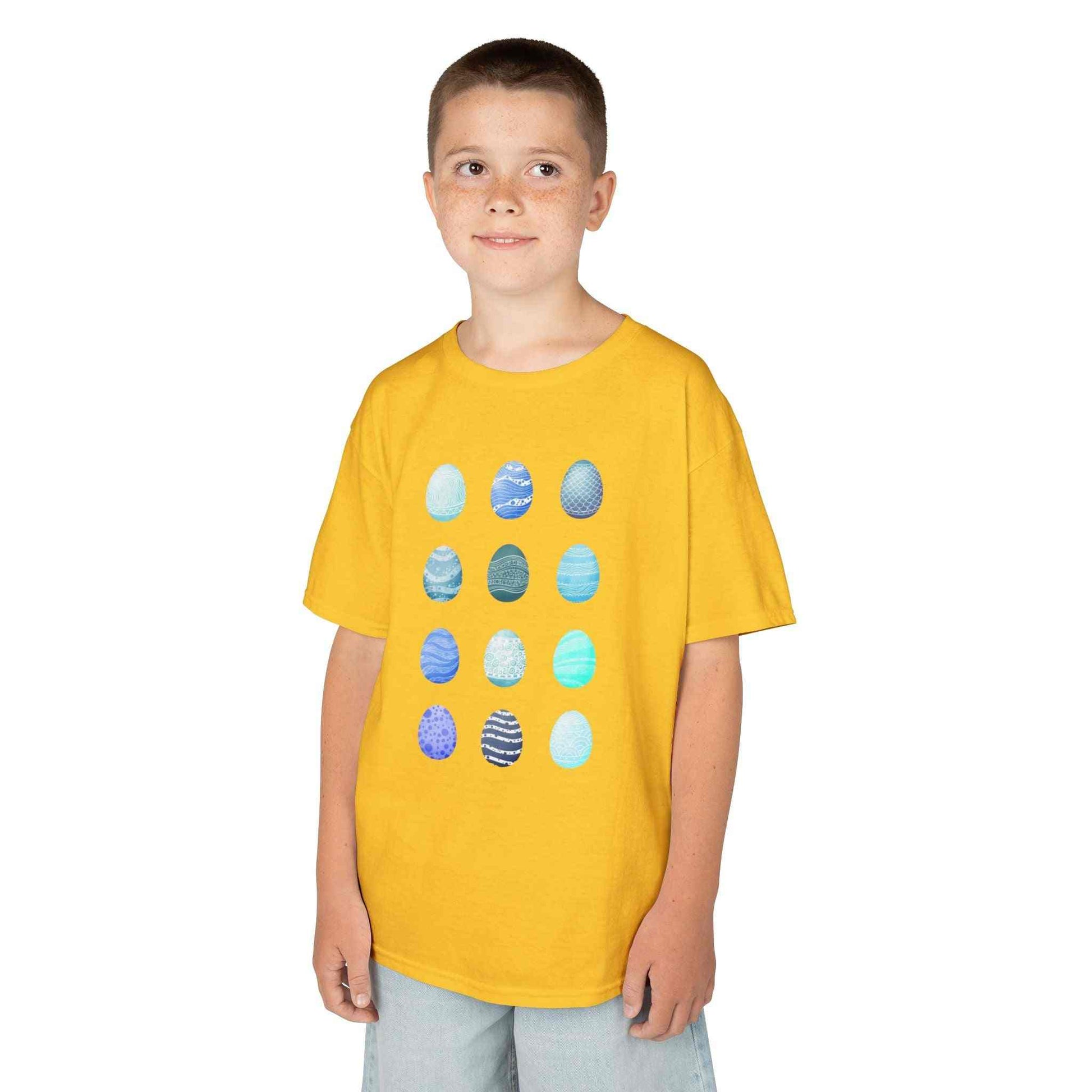 Kids tee with blue watercolor egg pattern on white cotton fabric