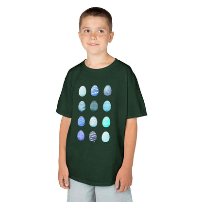 Kids tee with blue watercolor egg pattern on white cotton fabric