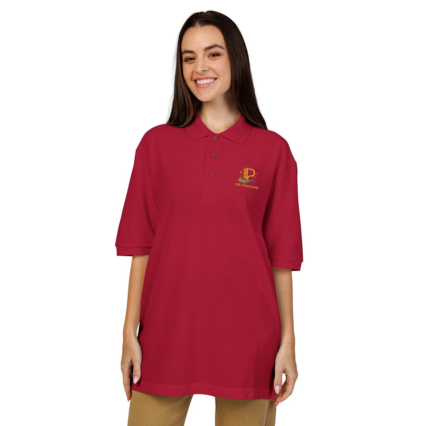 Lightweight embroidered crest polo shirt with relaxed fit, flat knit collar, metal buttons, and breathable side vents