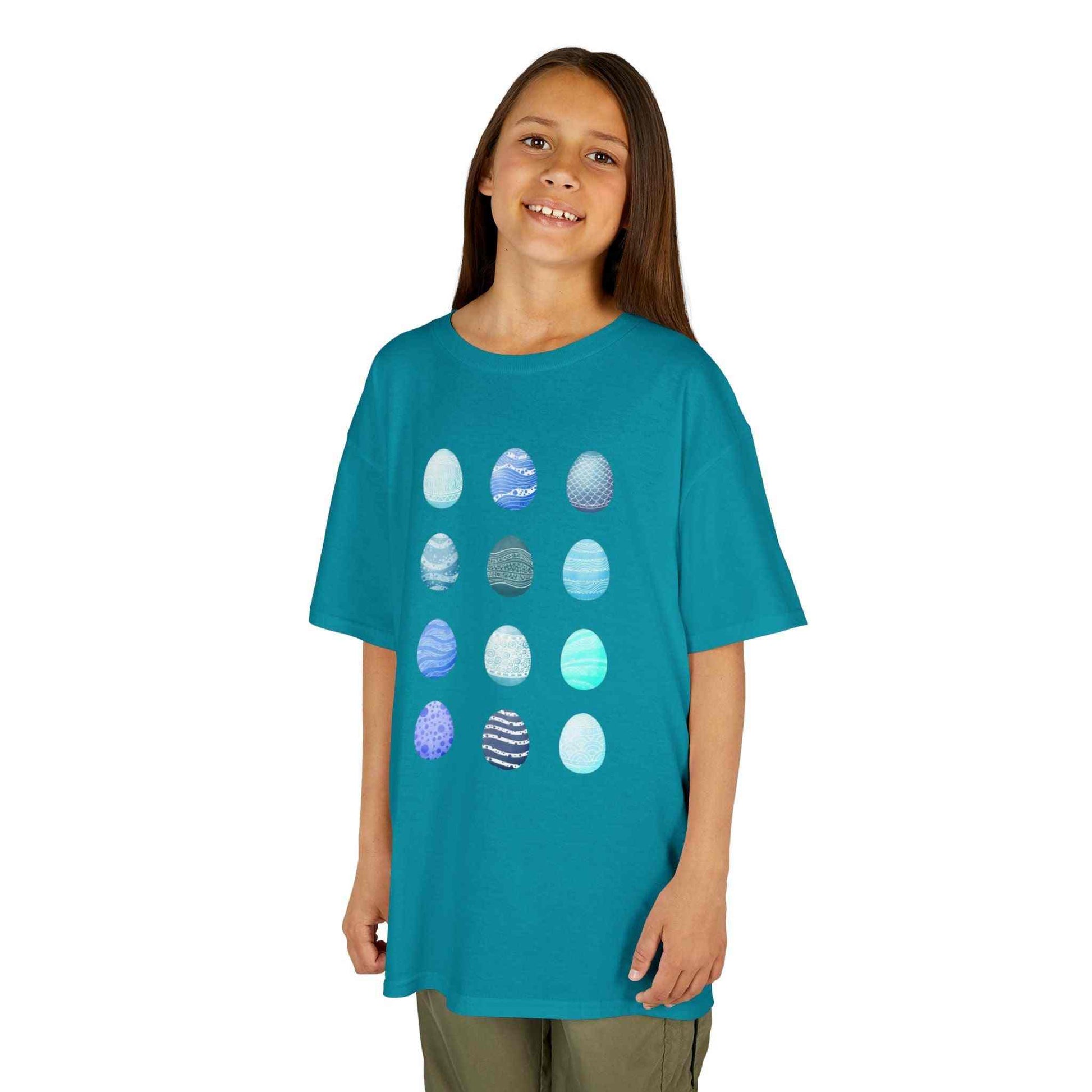 Kids tee with blue watercolor egg pattern on white cotton fabric