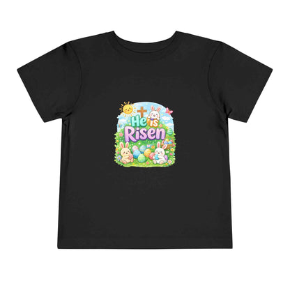 He Is Risen toddler tee with Easter bunny, cross, and pastel eggs design for kids