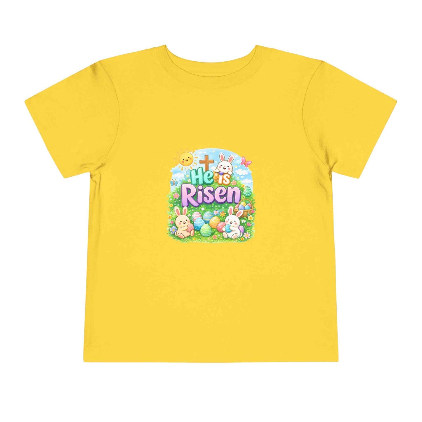 He Is Risen toddler tee with Easter bunny, cross, and pastel eggs design for kids