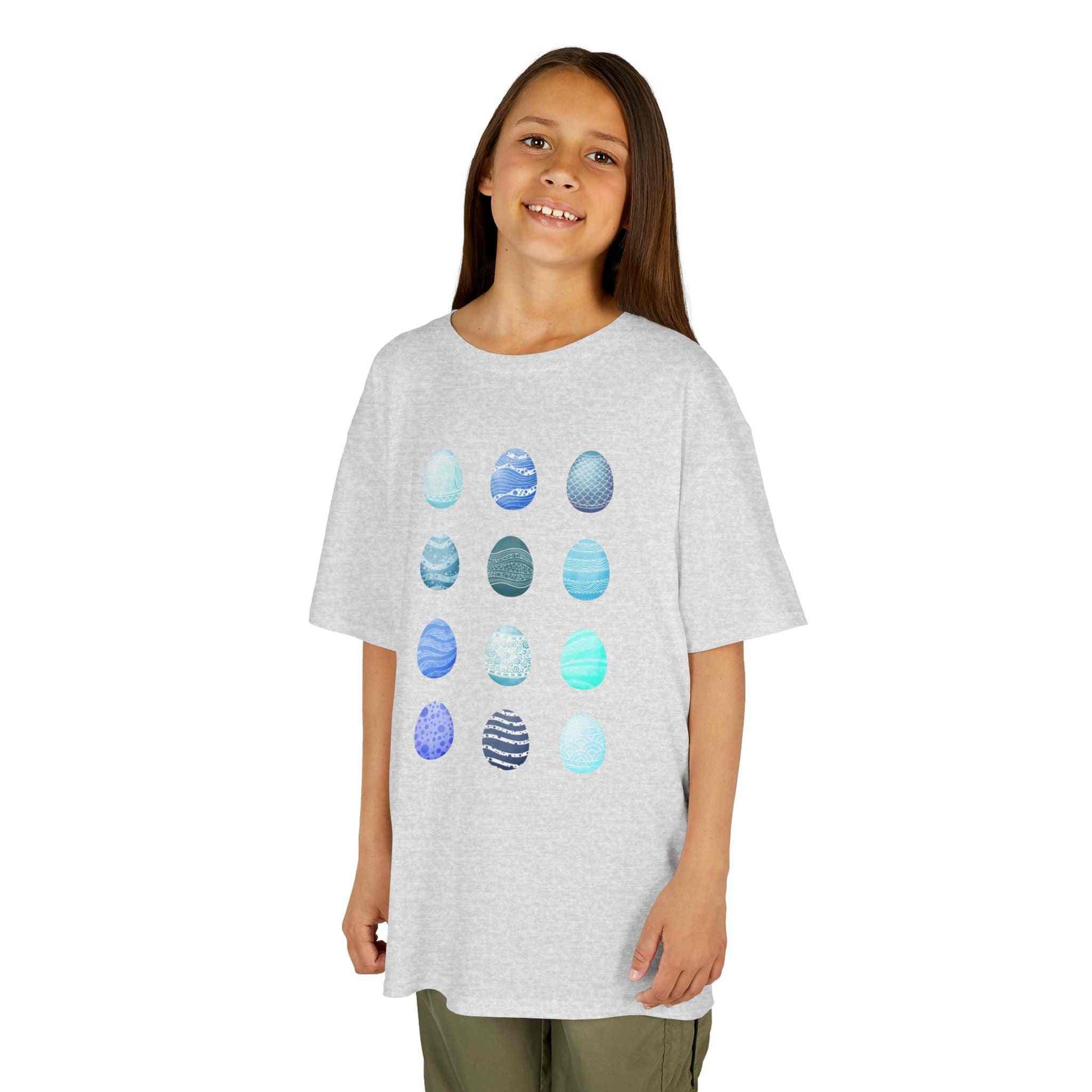 Kids white tee with blue watercolor egg pattern and breathable cotton fabric