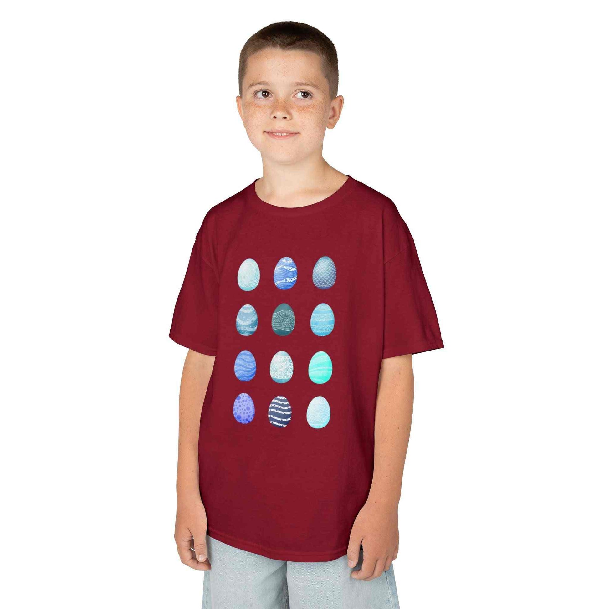 Kids tee with blue watercolor egg pattern on white cotton fabric