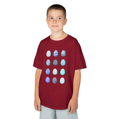 Kids tee with blue watercolor egg pattern on white cotton fabric