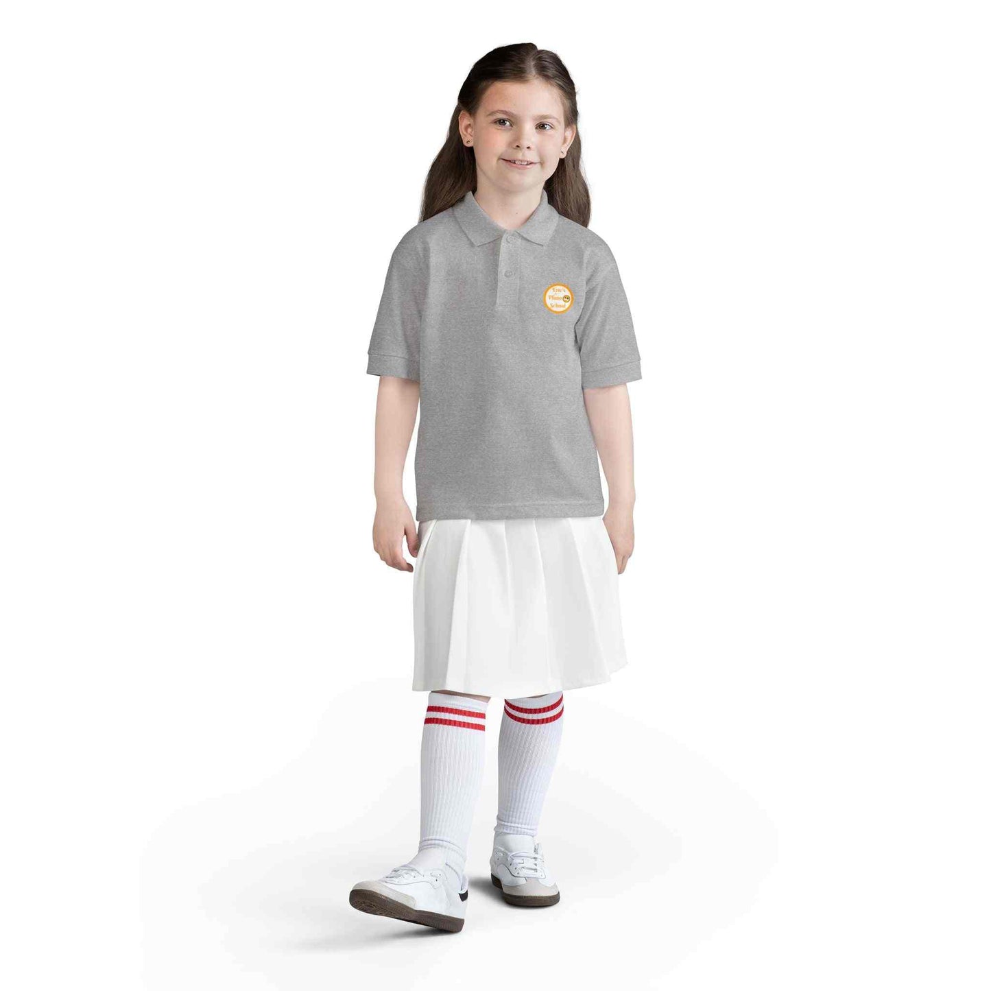 Youth polo shirt with gold Eric's Piano School logo, moisture-wicking fabric for kids' music lessons