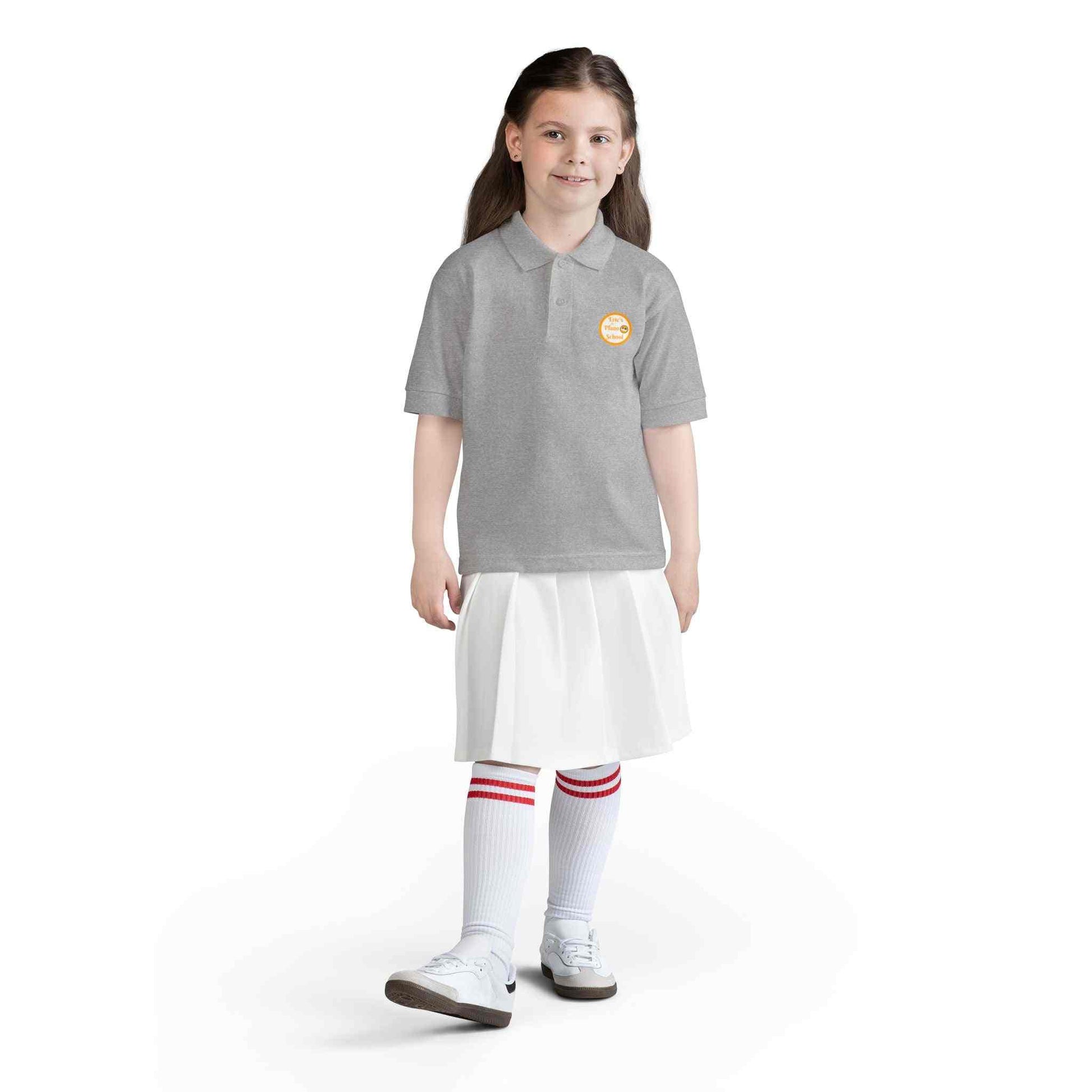 Youth polo shirt with gold Eric's Piano School logo, moisture-wicking fabric for kids' music lessons