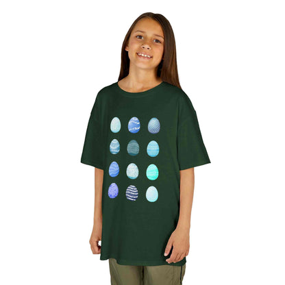 Kids tee with blue watercolor egg pattern on white cotton fabric