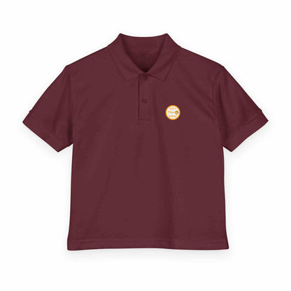 Youth gold polo shirt with Eric's Piano School logo for kids music lessons