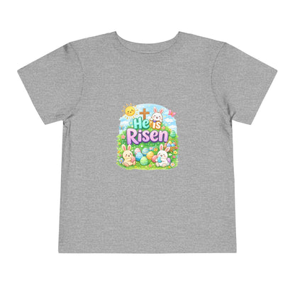 Toddler wearing He Is Risen Easter tee with bunny and cross design