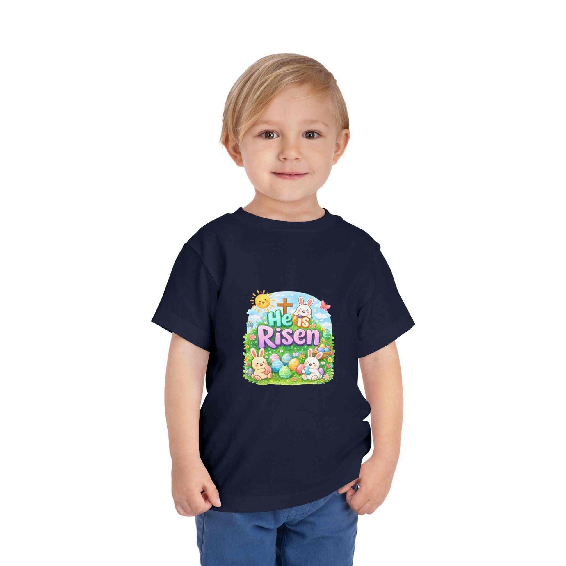 Toddler wearing He Is Risen Easter tee with bunny and cross design