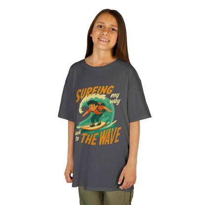 Surfing The Wave Kids T-Shirt with retro surfer graphic on soft cotton, unisex beach summer tee for kids