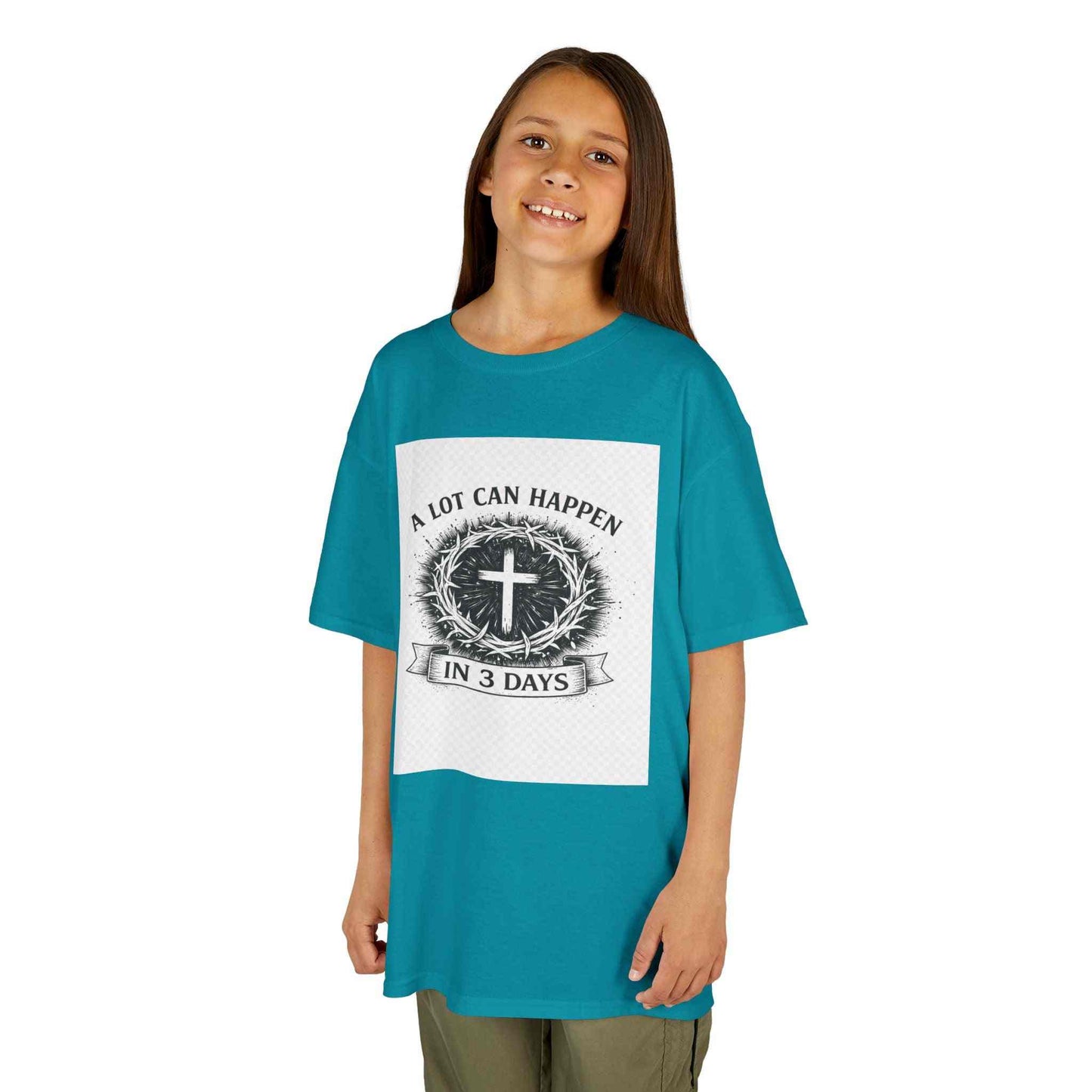 Kids Tee featuring vintage cross and wreath design with "A Lot Can Happen in 3 Days" slogan on soft midweight cotton