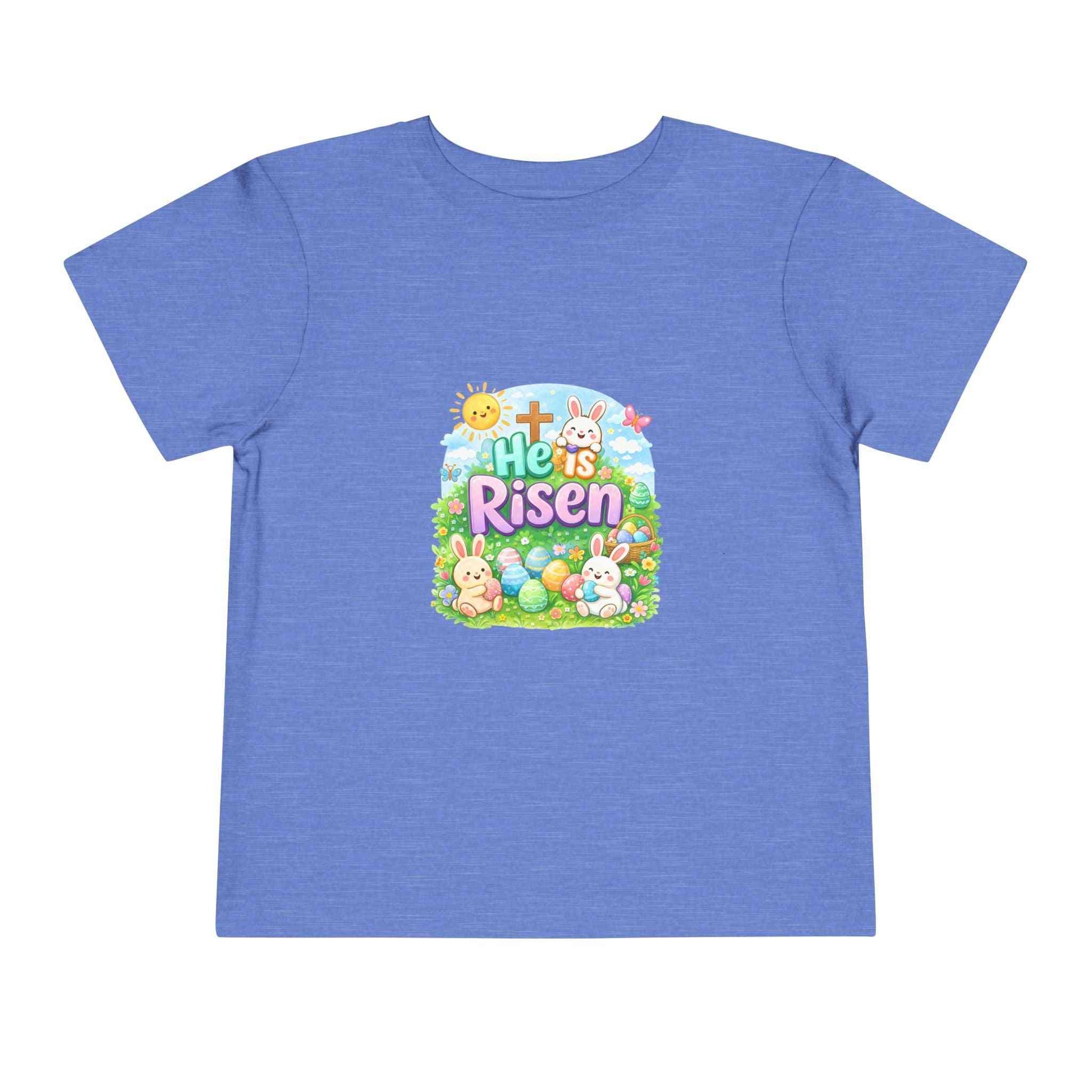 He Is Risen toddler tee with Easter bunny, cross, and pastel eggs design for kids