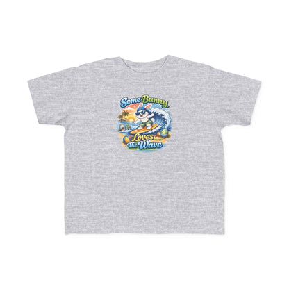 Toddler tee with cheerful surf bunny graphic and lightweight cotton, perfect for beach play – Some Bunny Loves The Wave design.