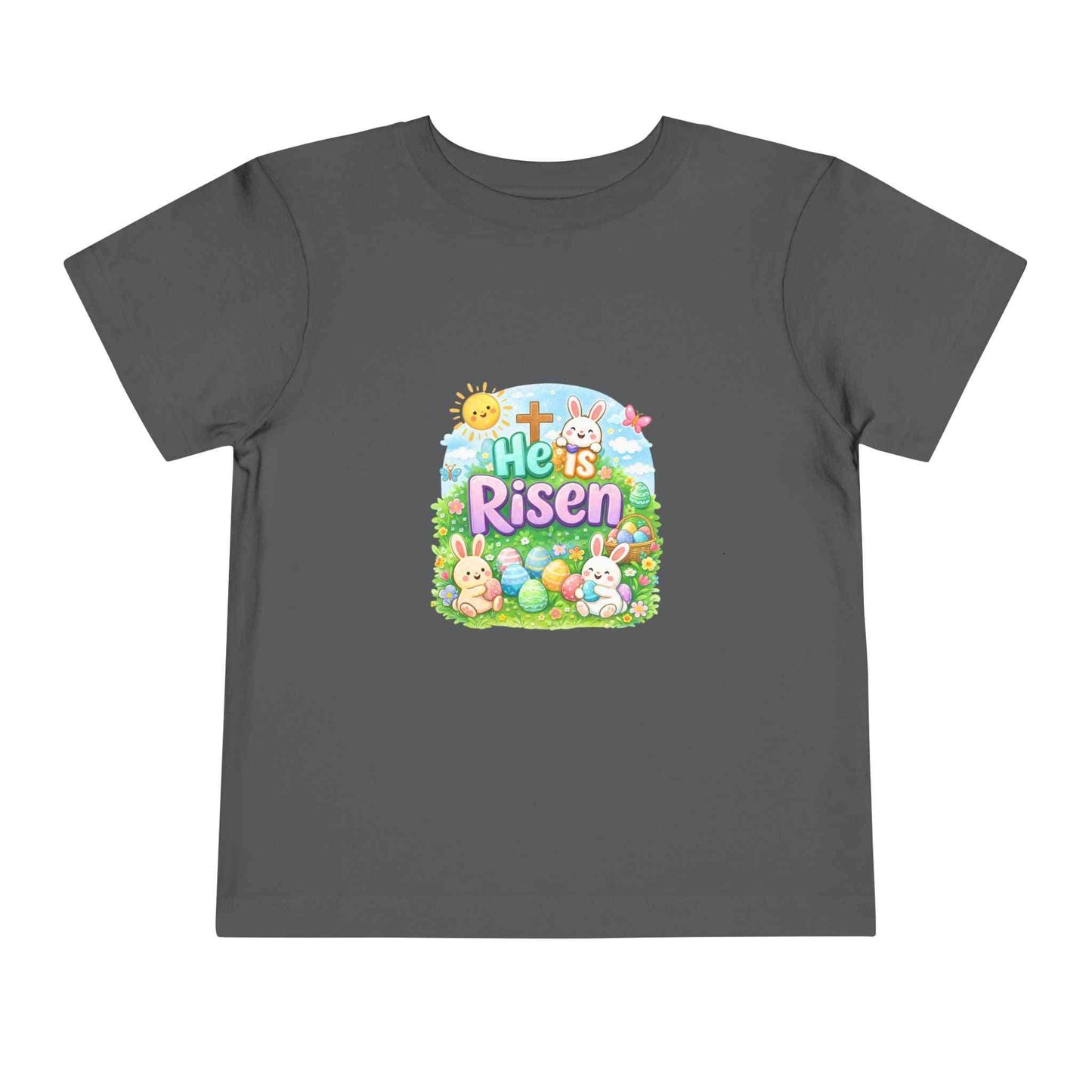 He Is Risen toddler tee with Easter bunny, cross, and pastel eggs design