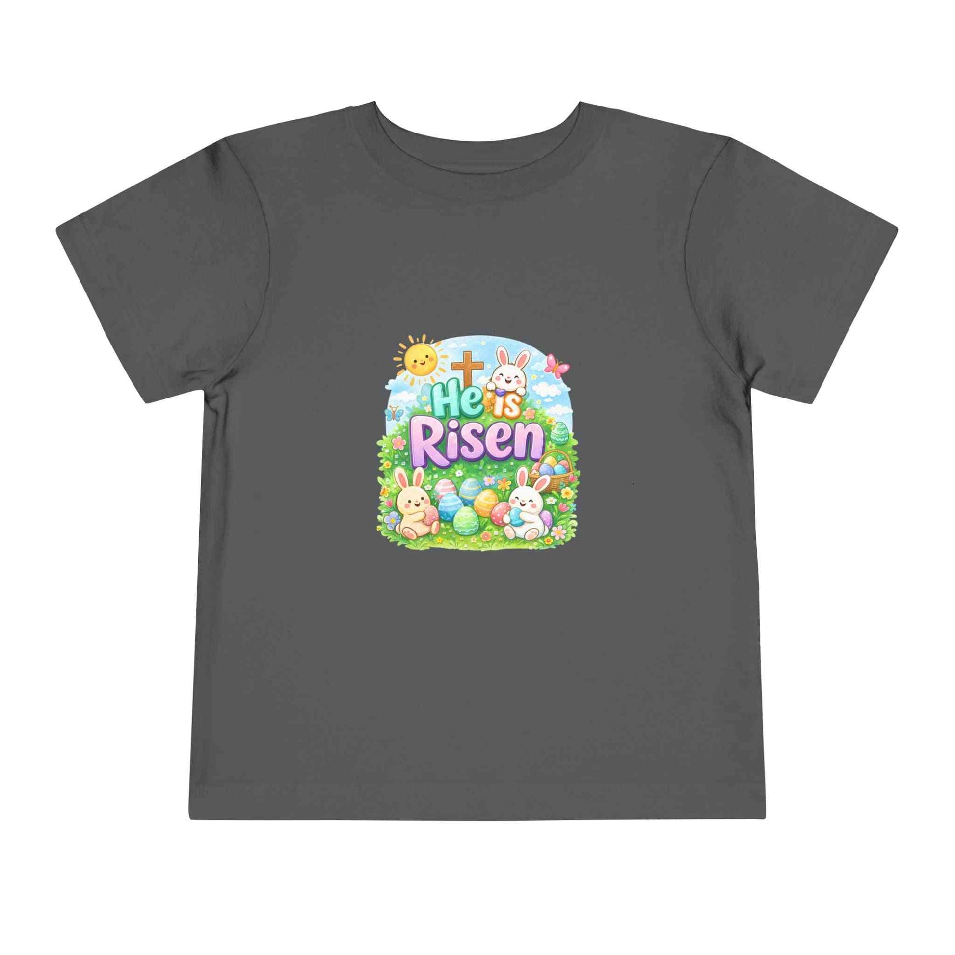 He Is Risen toddler tee with Easter bunny, cross, and pastel eggs design