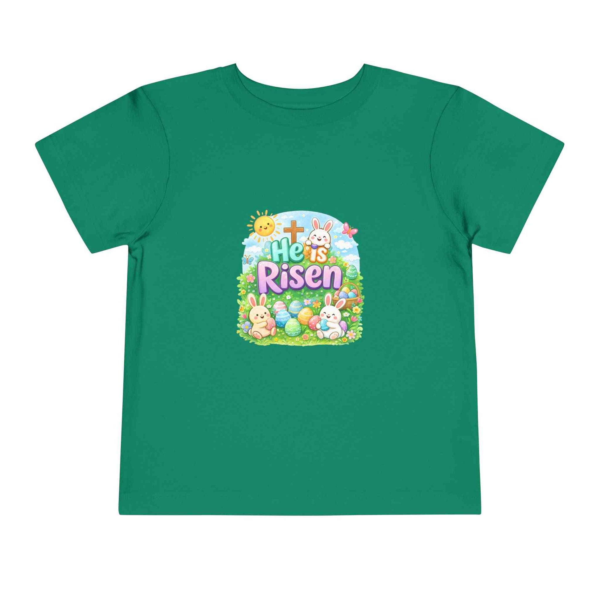 He Is Risen toddler tee with Easter bunny, cross, and eggs design on soft pastel shirt for kids
