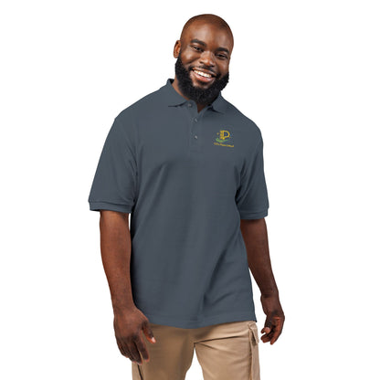 Embroidered crest polo shirt with relaxed fit, breathable fabric, flat knit collar, metal buttons, and subtle chest emblem