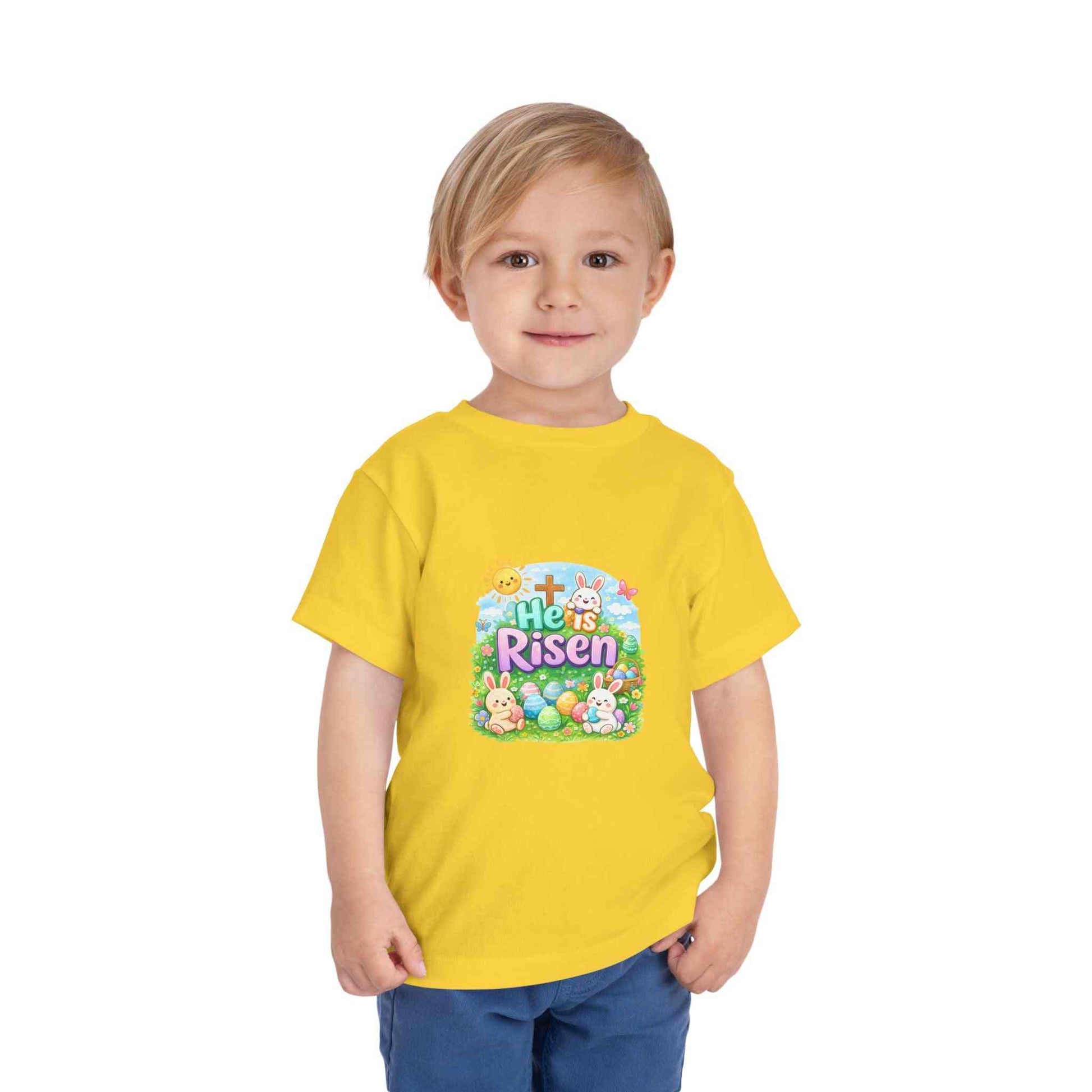 He Is Risen toddler tee with Easter bunny and cross design on soft pastel kids shirt