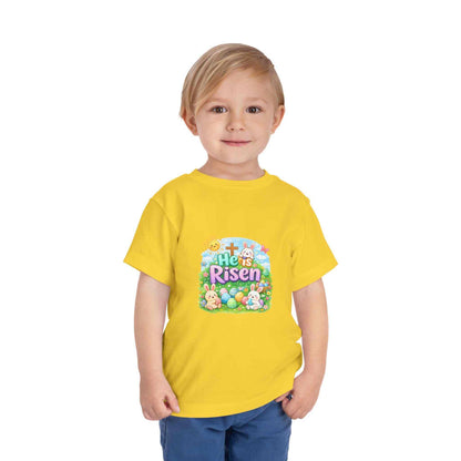 He Is Risen toddler tee with Easter bunny and cross design on soft pastel kids shirt