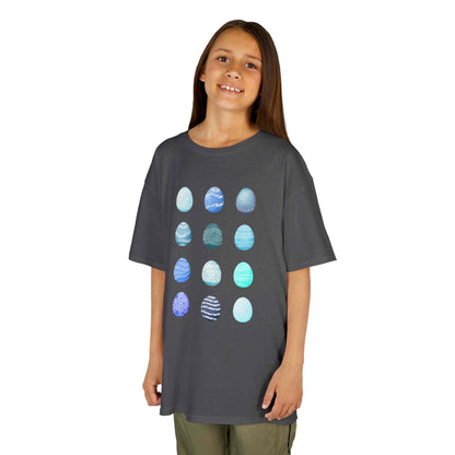 Kids tee with blue watercolor egg pattern on white cotton fabric