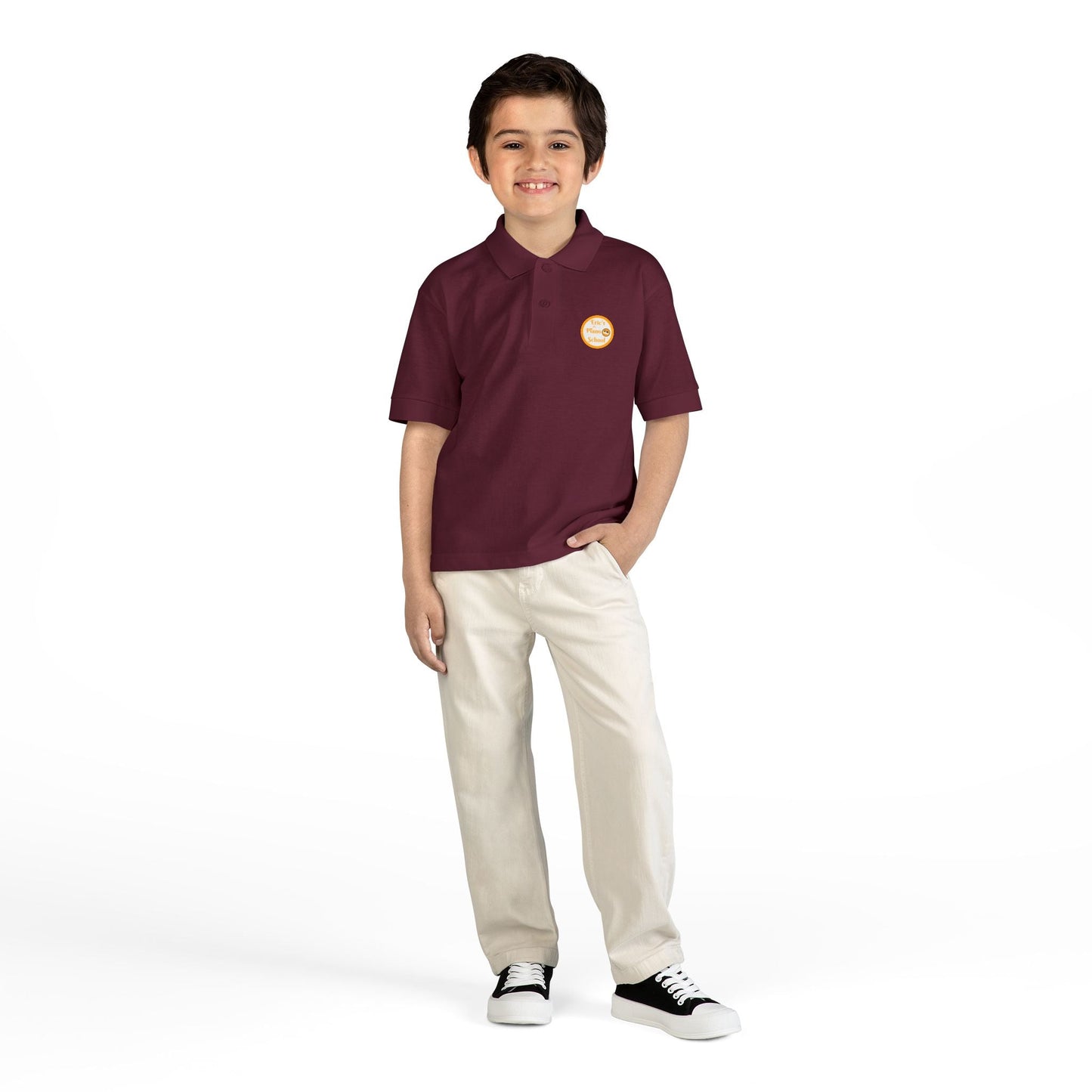 Youth polo shirt with gold Eric's Piano School logo for kids' music lessons